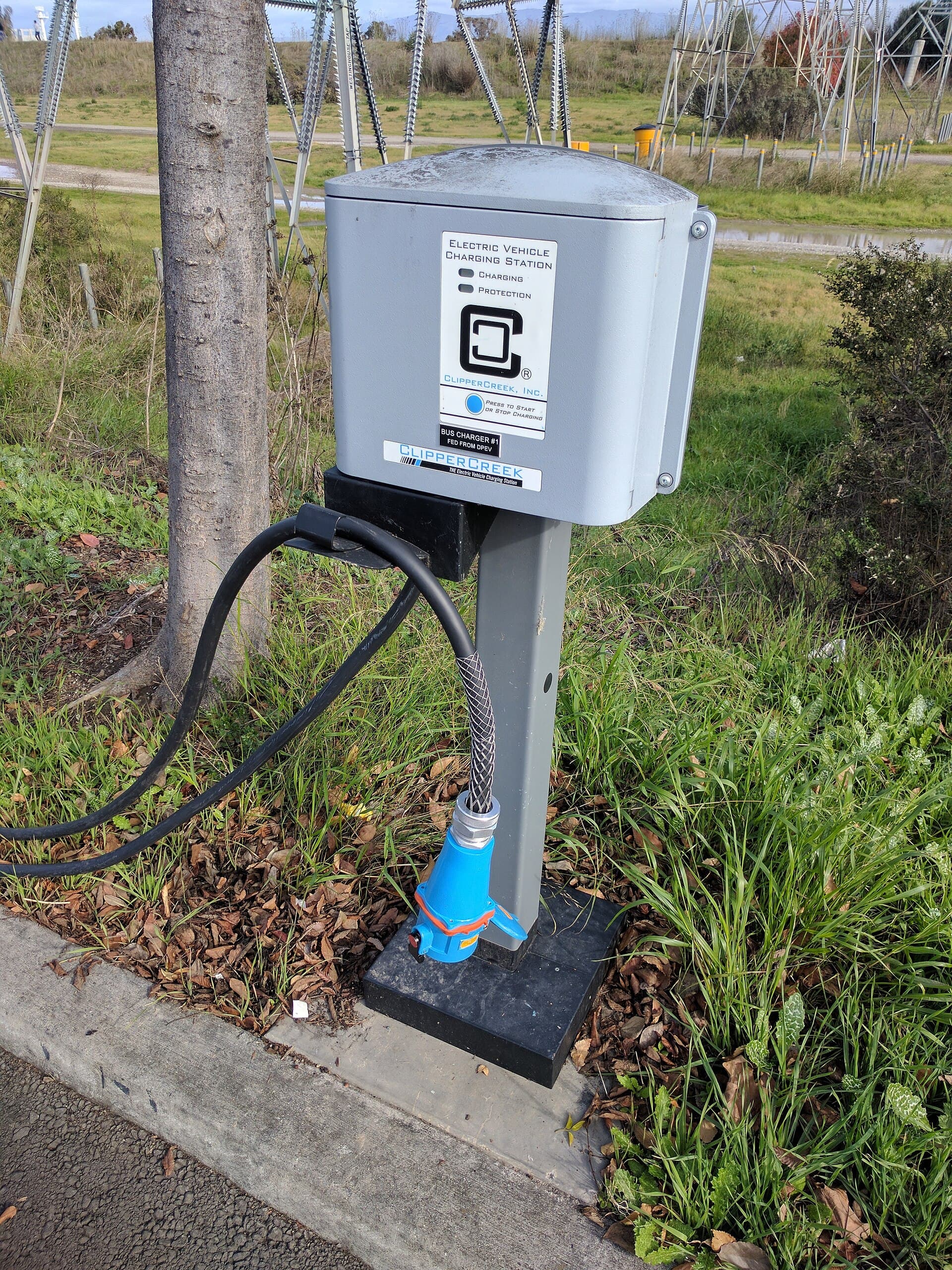 Residential-style EV charging station with cable ready for Level 2 charging